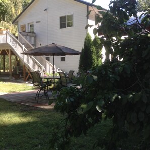View from plum tree. Lights and Bluetooth access in the umbrella. 