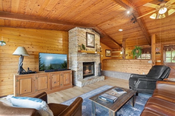 Main Floor Living Area with Floor to Ceiling Wood Burning Fireplace