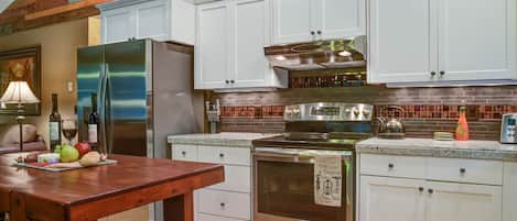 Kitchen with island and seating for two.