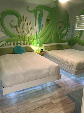 Award winning artist mural and FLOATING BEDS! Octopus room sleeps up to 4. 