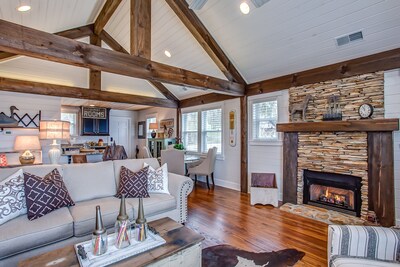 Exposed beams shipped in from N. Y. add just the right rustic feel to open area.