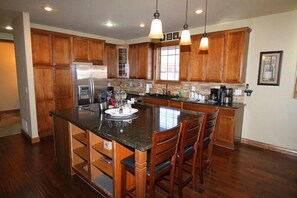 Over-sized kitchen island for easy meal prep and serving