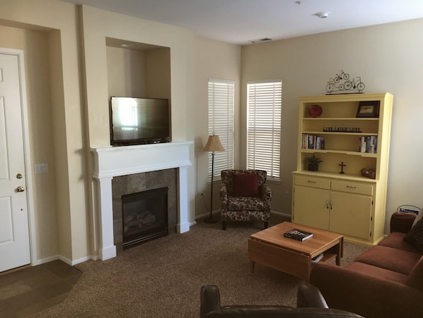 View from kitchen - 43 inch TV, gas fireplace