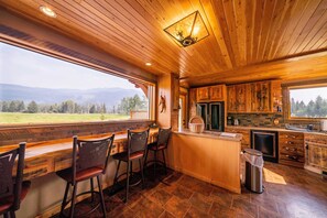 Luxurious kitchen with incredible views and breakfast bar