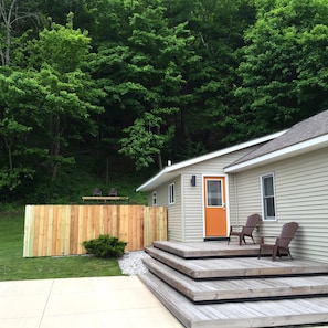 front porch & steps. Also seen is the small deck on the back hill.