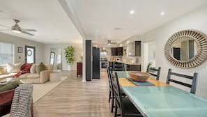 Living room with n open floor plan into dining and kitchen area