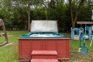 Hot tub is on and set at 98 degrees  Now located off the deck shown in pic 2.