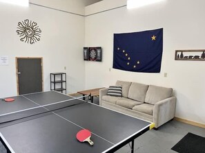 (6) darts and ping pong in the spacious game room