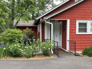 Main entrance with a security lock and a Weber propane grill.