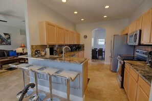 Large gourmet kitchen with granite counters, brand new appliances