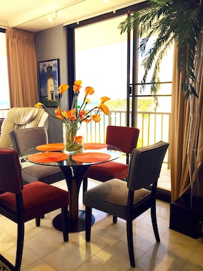 Dining room with ocean and mountain view.