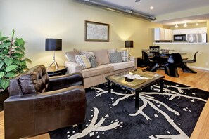 Living and Dining area.  Large table with banquette seats 8.