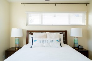 Second bedroom with queen bed and blackout curtains