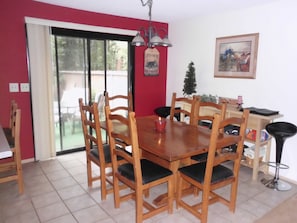 Comfortable seats 6 plus several stools at kitchen counter. 