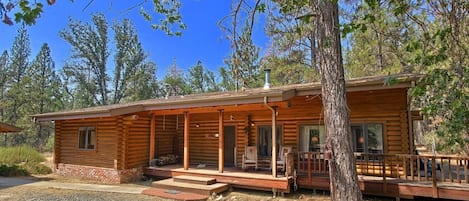 Front view of Shanks' Log Home in the Woods
