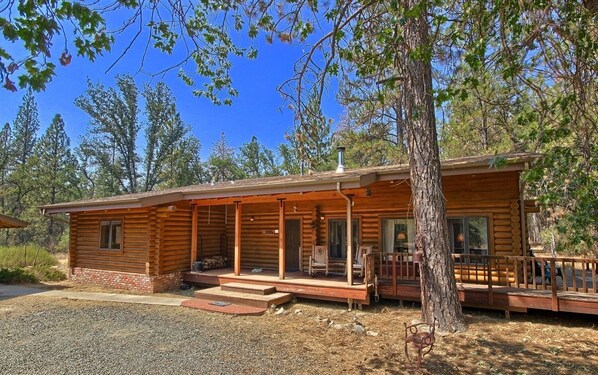 Front view of Shanks' Log Home in the Woods
