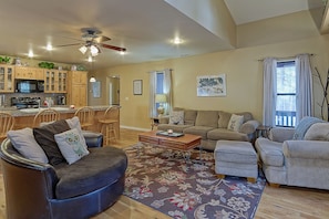 Awesome great room! The brown chair spins to face the couch or the fireplace.
