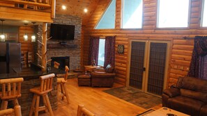 Amazing open feel with vaulted knotty pine ceiling.  Lots of natural light.