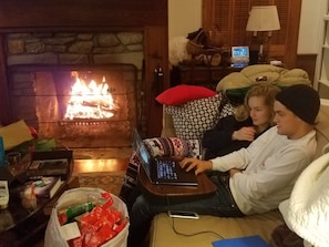 Enjoying time by the fire on Christmas evening