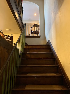 Stairway to upstairs apartments with keypads, the only shared space