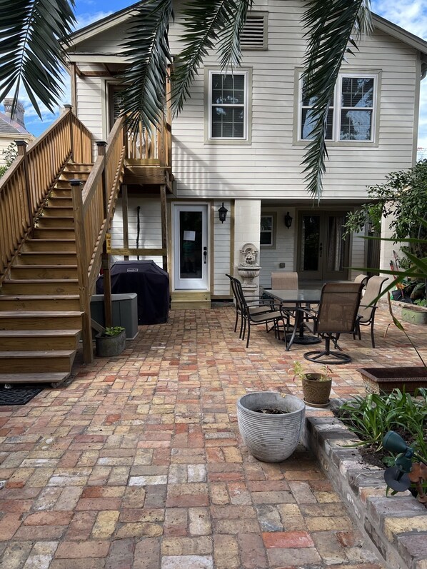 Outdoor view: Back door ground level, left side entry to shared laundry room!