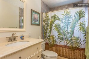 Upstairs bathroom with walk-in shower and washer & dryer.