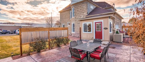 Wide Open Patio Area Between the Garage and the House