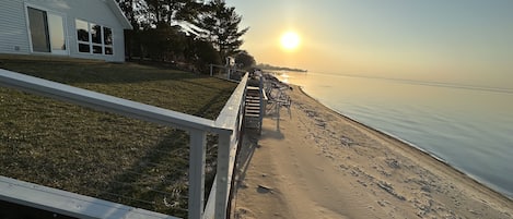 Sandy Beach & Sunset Views! Stairs provide easy access to the beach and lake.