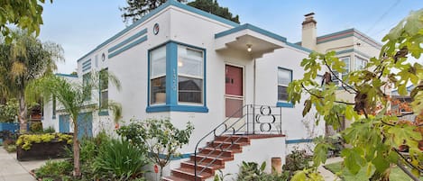 Art Deco duplex with lush gardens and private entry. 