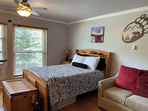 Bedroom/Living Area with Queen Bed, Pull-Out Sofa, Closet,  Dresser & 55" TV
