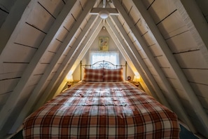 Queen bed in open sleeping area