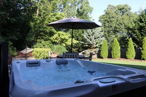 Pamper yourself in the hot tub within the private, enclosed back yard!