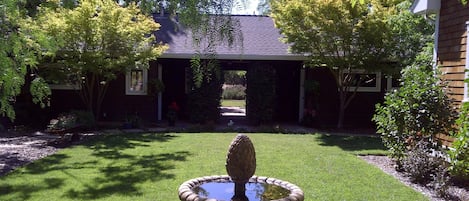 Front of Cape Cod cottage with Kitchen to the left and Bedroom on the right.