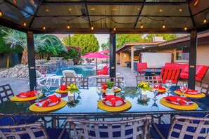 Enjoy meals outside under the well-lit Ramada!