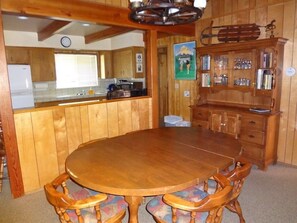 A view of the cabin's dining area and kitchen.
