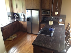 Gourmet kitchen with Jen Air range, Kitchen Aid stand mixer, and much more.