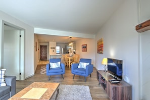 Living room with view into dining area and kitchen