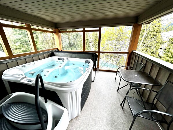 Hot tub off the bedroom, overlooking the outdoor pool