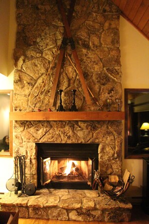 Relax by the real wood-burning fireplace in the Great Room..