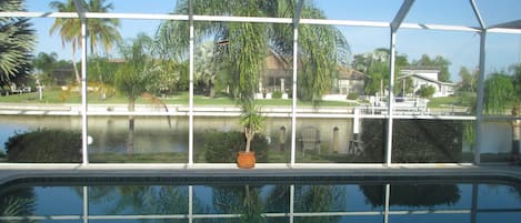 Relax on the lanai by the pool and overlooking the canal.