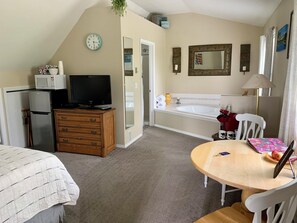 Private soaker tub, dining area, coffee tea, and basic breakfast snack provided.