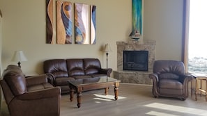 Light-filled living room with updated plank flooring