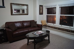 Full Size Leather Sofa Bed Couch with Plenty of Seating on Window Seat.
