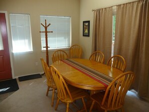 Dining table is set to seat 6 but an additional leaf and 2 chairs can be added.