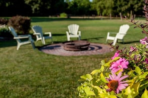 Enjoy the Fire Pit just off the front porch, perfect for the cooler evenings.