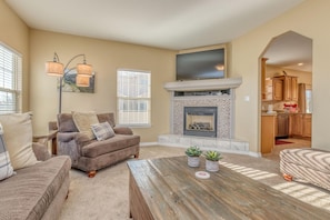 Living room with smart TV and fireplace