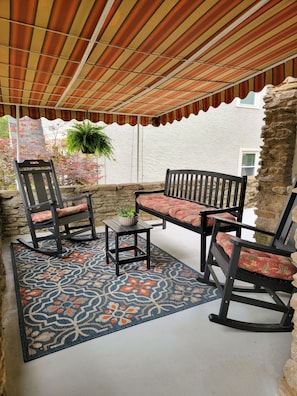 Front porch seating area. Rain or shine, sit and watch the folks walk by.
