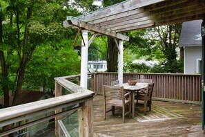 Amazing deck off main floor overlooking waterfall