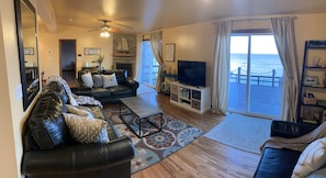 Living room area looks directly out to beautiful view 