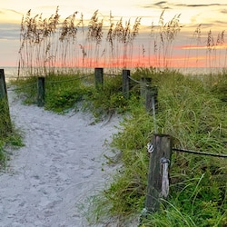 The beach is just through the crosswalk (across Gulf Drive N.) from your villa.